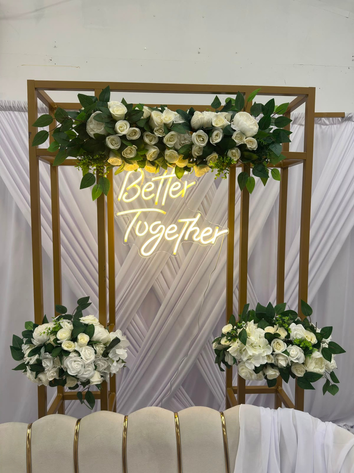 Balloon arch with Better Together neon sign