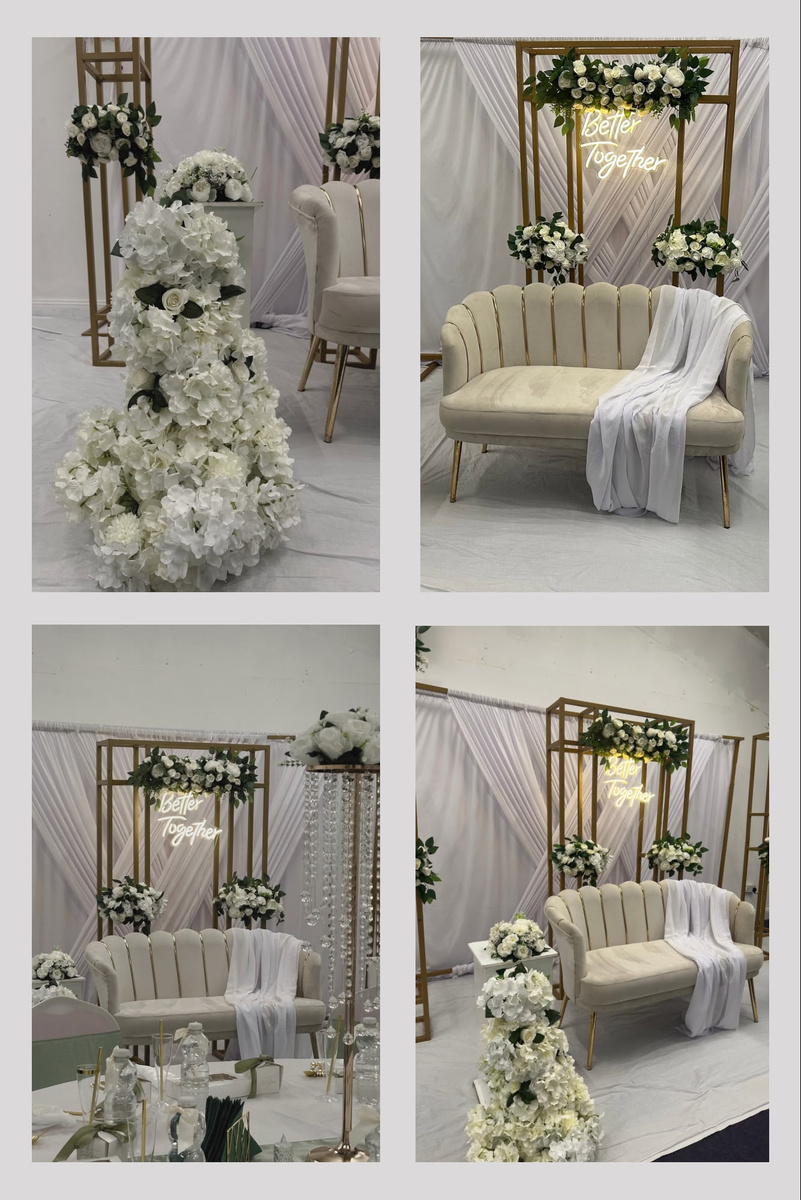 Chandelier arch with white floral arrangements at an Atelier Bloom styled event