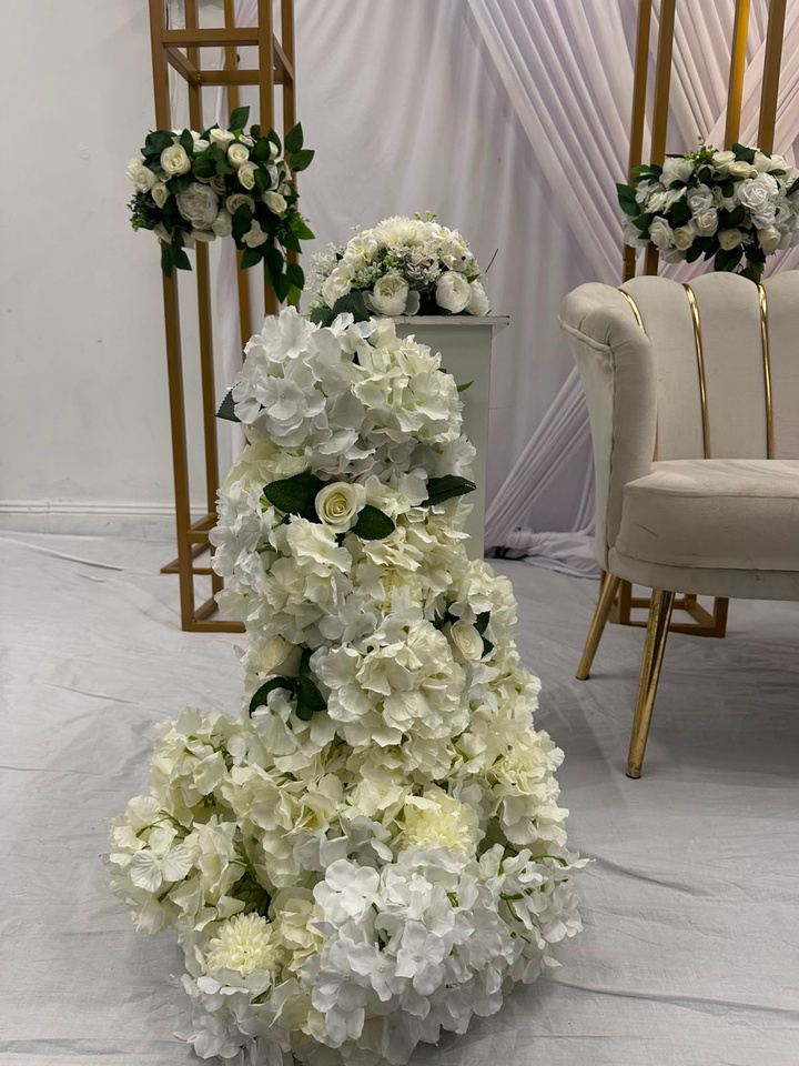 Gold stand with floral arrangement