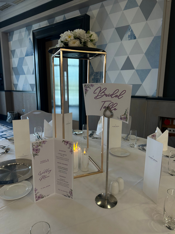 Gold stand styled with place cards