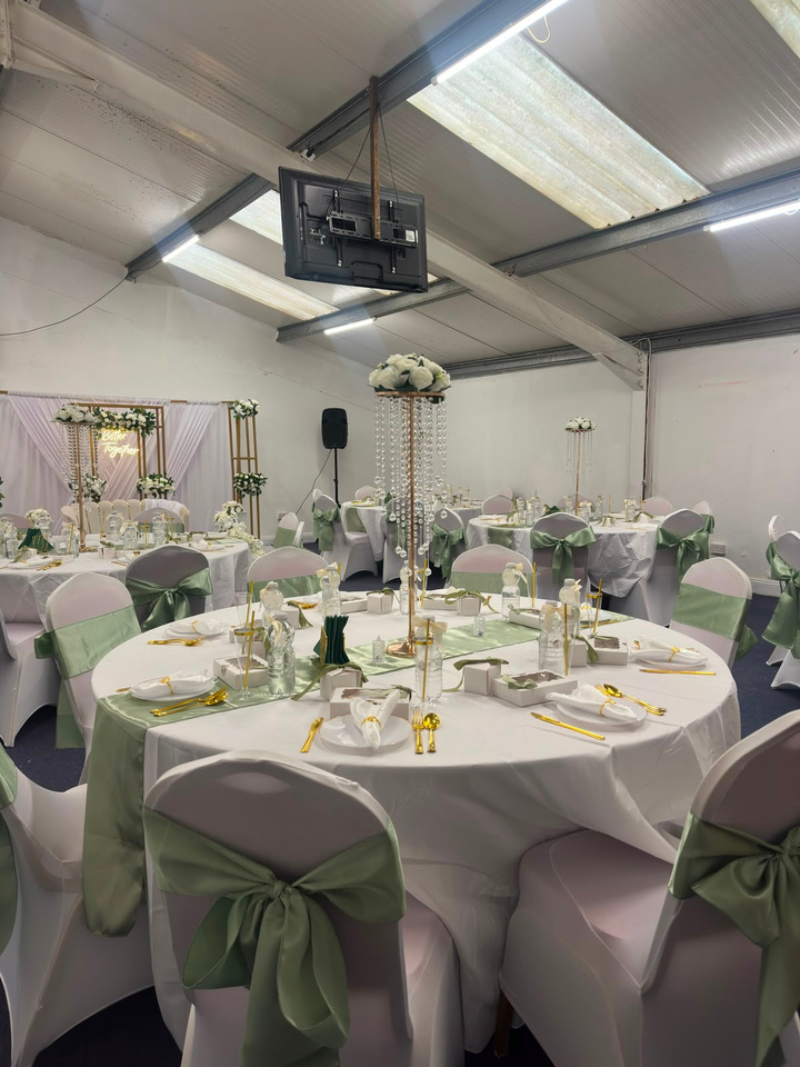Round tables styled with sage green accents